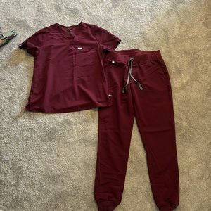 M Figs scrubs: wine red Catalina one pocket top, Zamora normal waisted joggers.